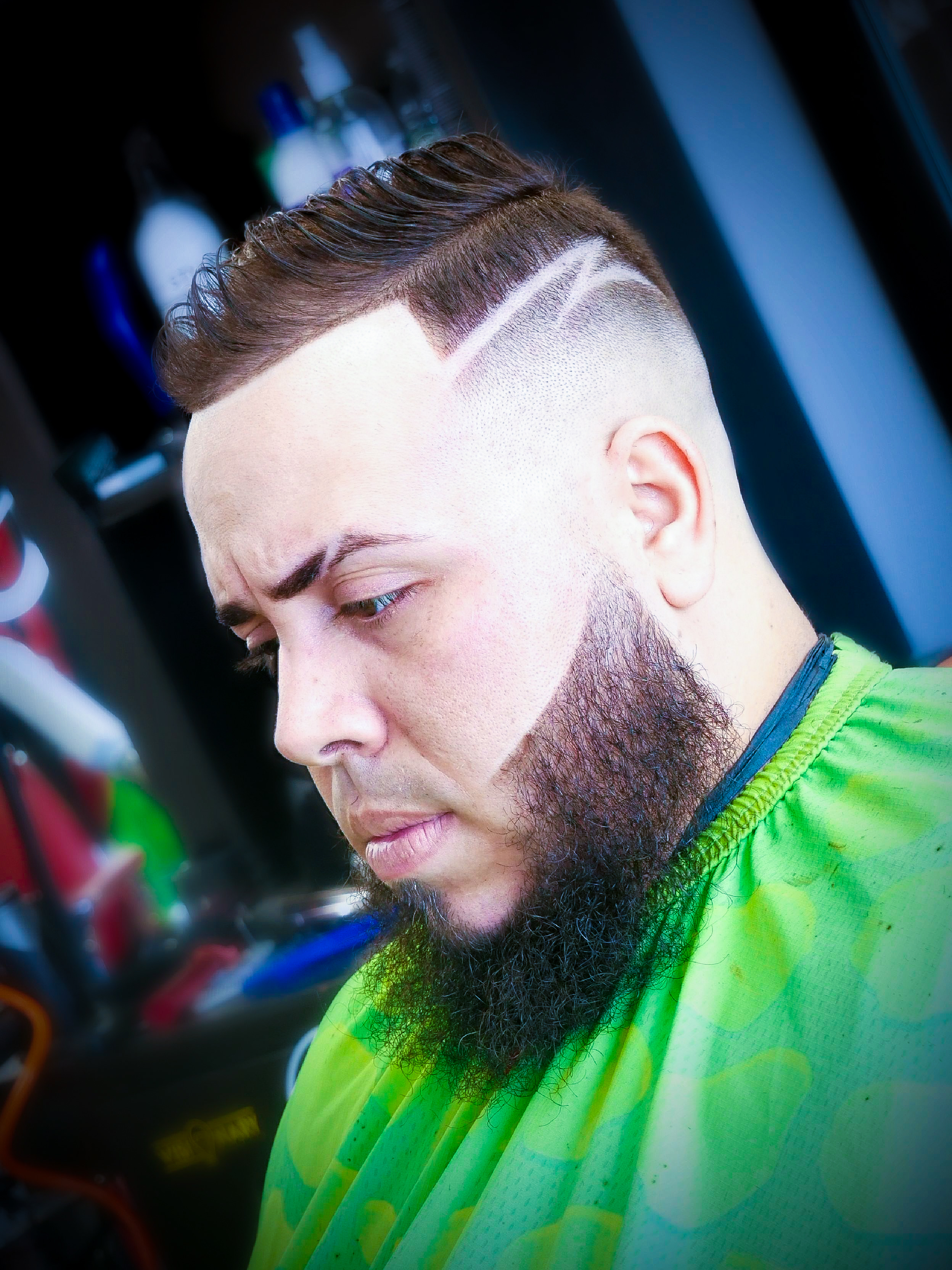 Side part fade with design lines and beard